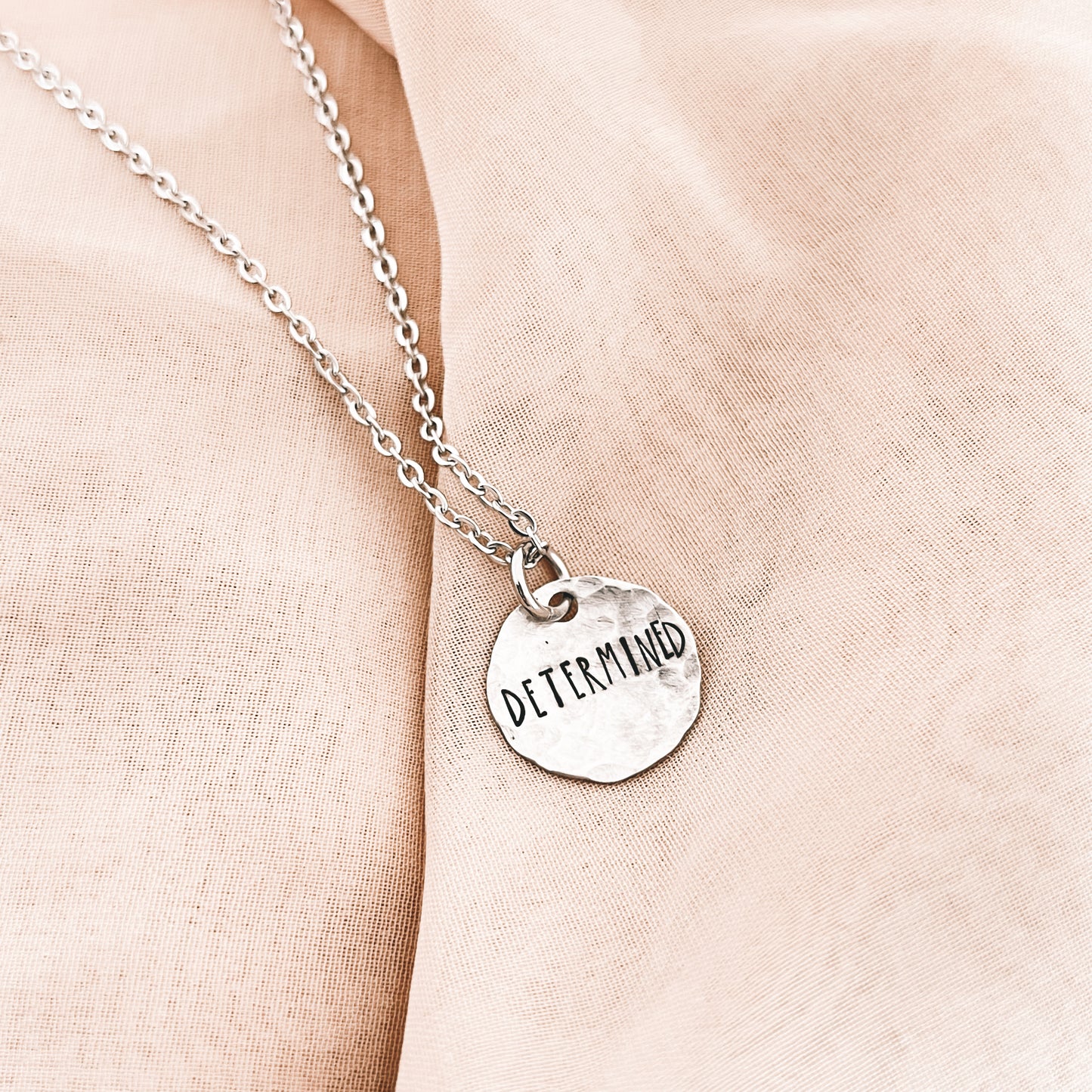 DETERMINED DISK NECKLACE